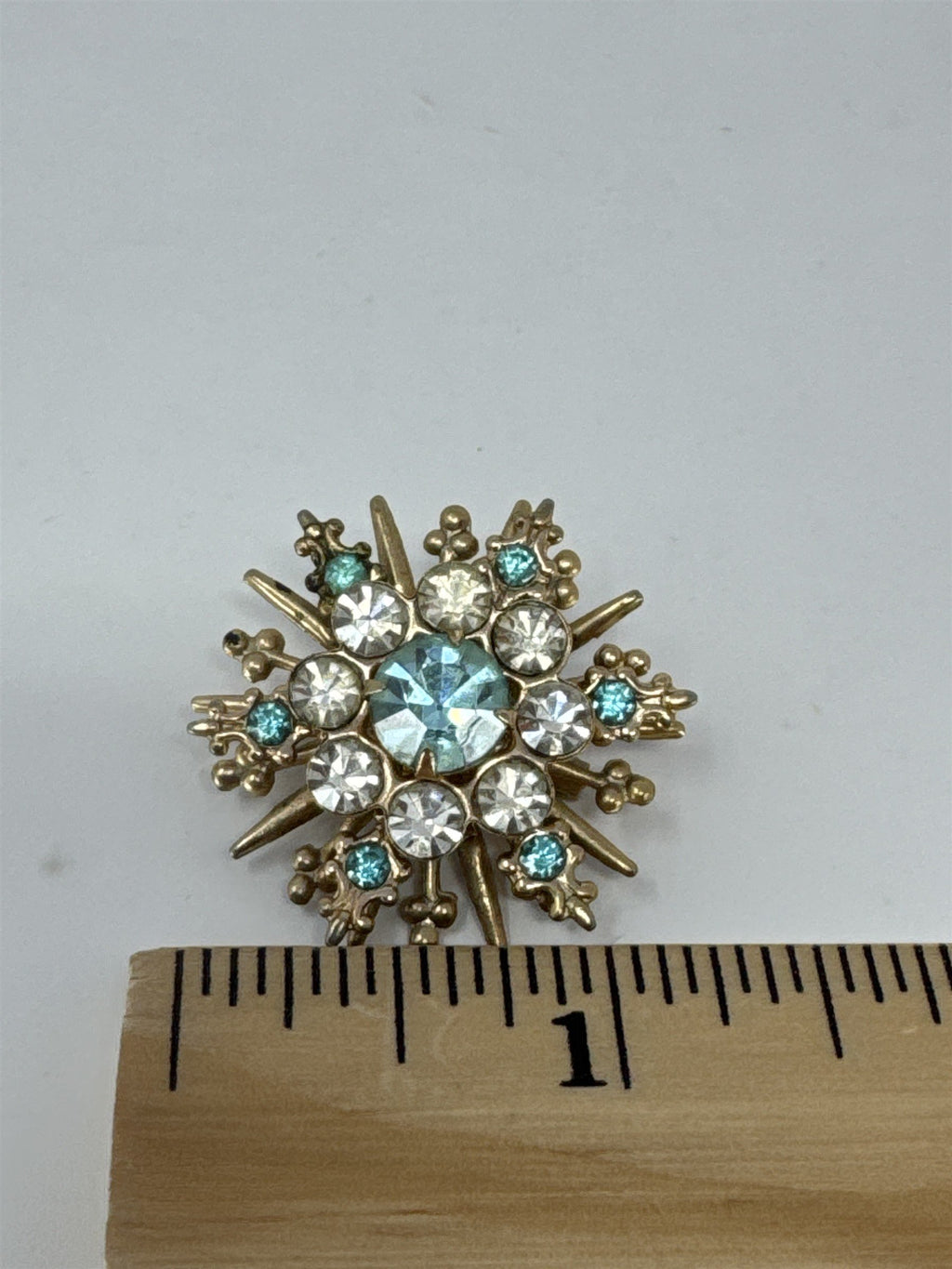 Vintage Snowflake Brooch Blue White Rhinestone Sunburst Pin Gold Tone