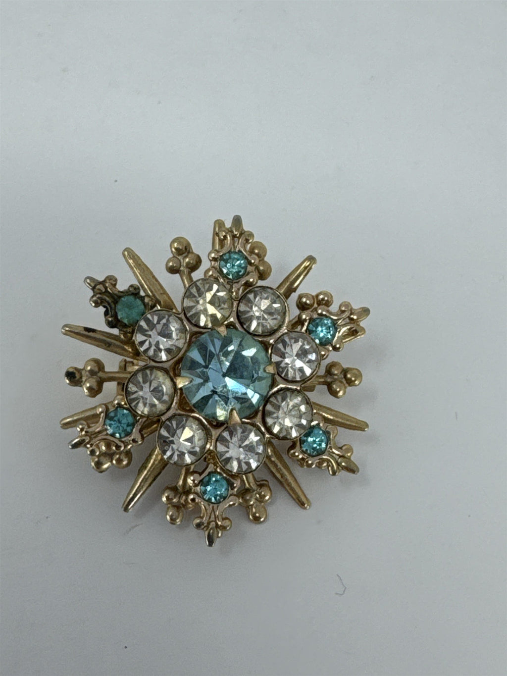 Vintage Snowflake Brooch Blue White Rhinestone Sunburst Pin Gold Tone