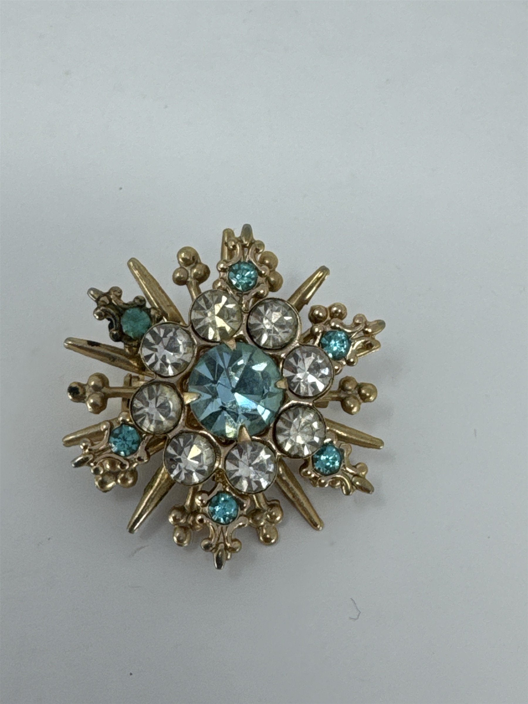 Vintage Snowflake Brooch Blue White Rhinestone Sunburst Pin Gold Tone